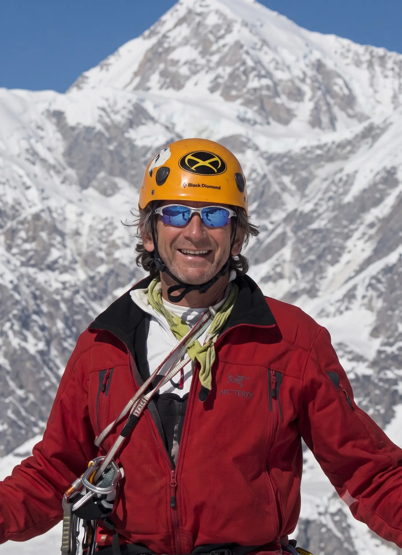 Portrait of broker Jack Gerstein in climbing gear on a snowy Himalayan peak